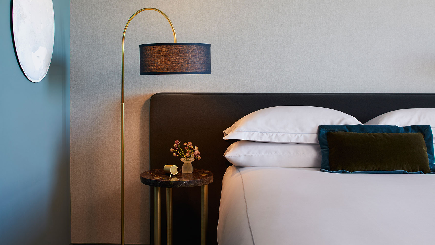 Kimpton Saint George guest bed and side table